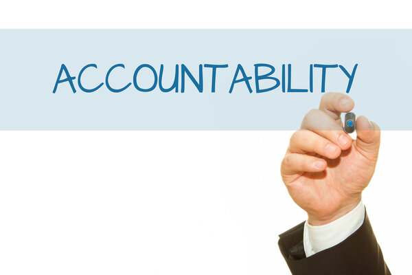 cropped shot of businessman writing accountability inscription isolated on white