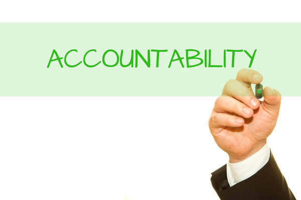 cropped shot of businessman writing accountability inscription isolated on white