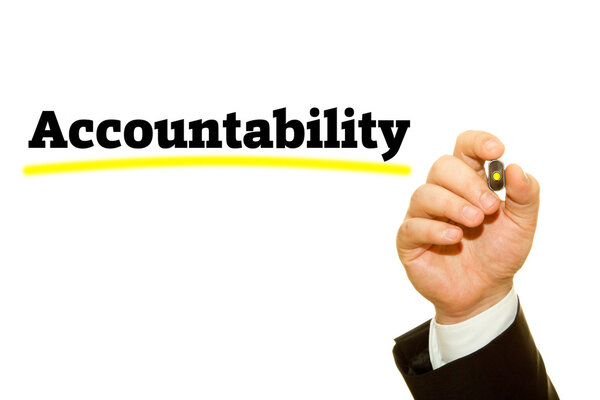 cropped shot of businessman writing accountability inscription isolated on white