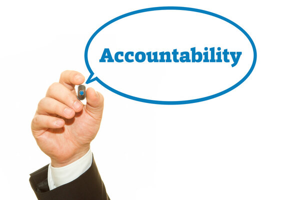 Businessman hand writing Accountability with a marker.