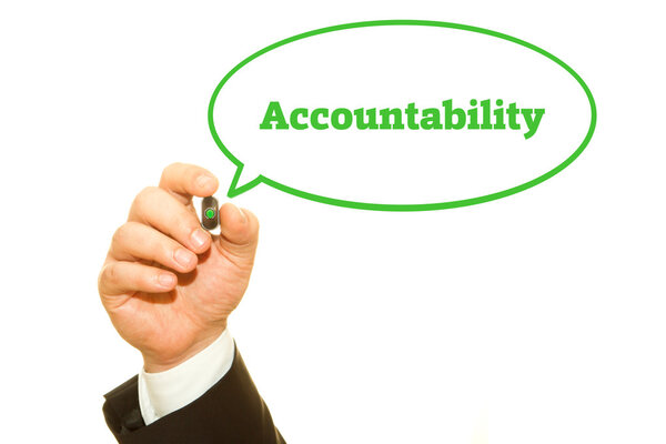 Businessman hand writing Accountability with a marker.
