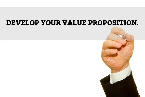 Cropped Shot Businessman Writing Develop Your Value Proposition Inscription Isolated — Stock Photo, Image