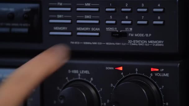 Close-up mans hand turns on the mono mode on the retro tape recorder. Listen to music in mono mode. — Stock Video