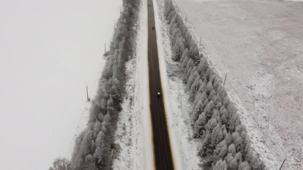 Aerial shot of slippery road a winter day. — Stock Video