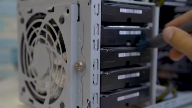 Professional maintenance worker staff is pressure cleaning PC HDD slots.