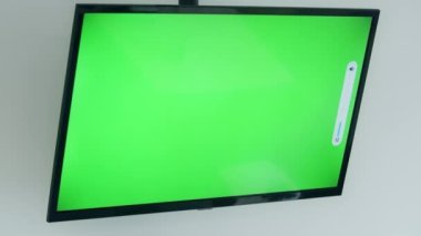 Watching Olympic games on the TV screen. Volume up