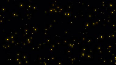 Siyah arkaplanda alev kıvılcımları gibi parlayan altın parçacıklar yükseliyor