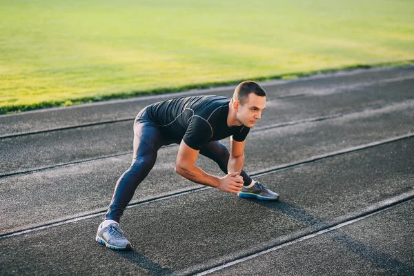 Man stretches the body — Stock Photo, Image