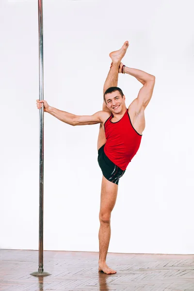 Jovem forte pole dance homem — Fotografia de Stock