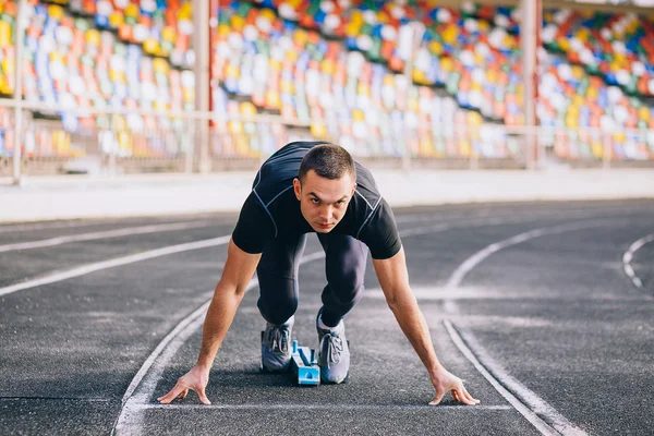 Sprinter leaving starting blocks — Stock Photo, Image