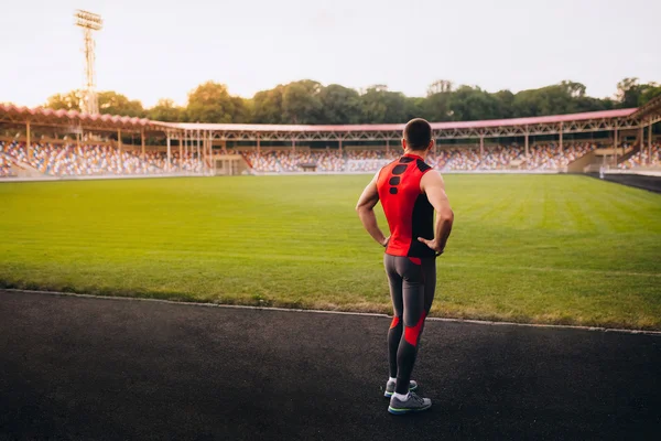 Back view of male athlete in stadium. — Stock Photo, Image