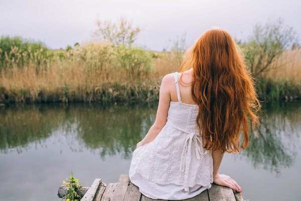 Beautiful young woman with wreath