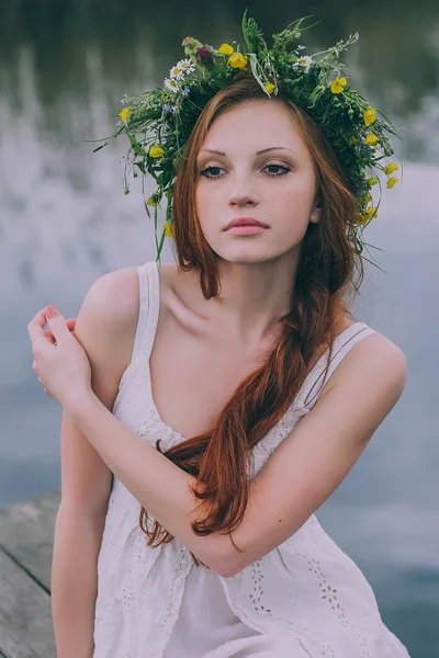Beautiful young woman with wreath — Stock Photo, Image