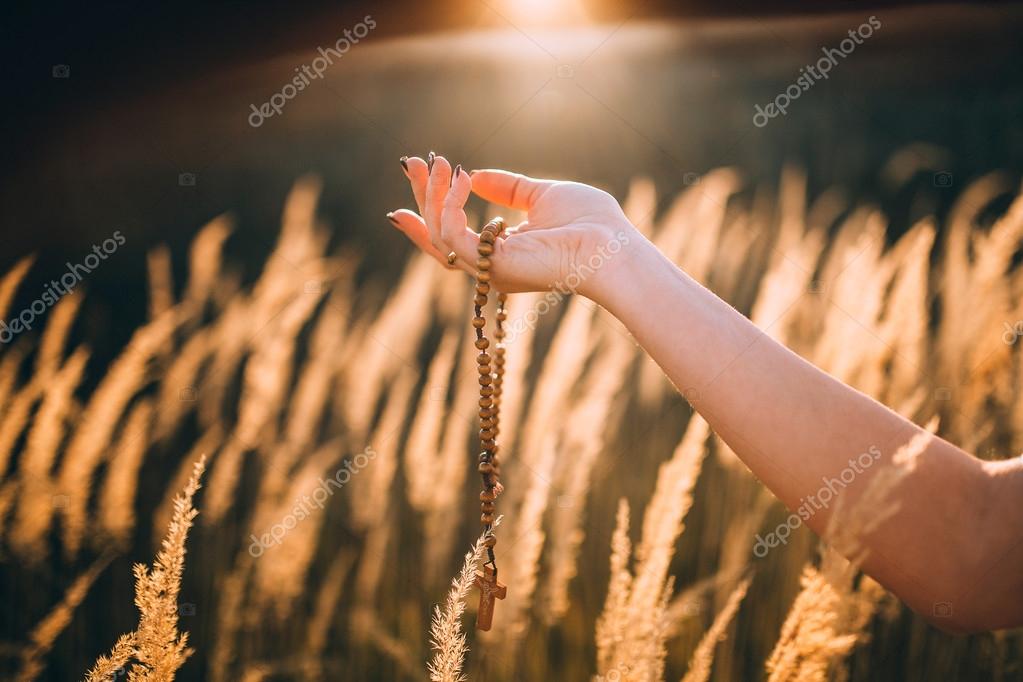 Wooden Rosary In Hand Stock Photo Amvorsuf 111772498 Wooden Rosary In Hand Against Sun Lighted Grass Photo By Amvorsuf