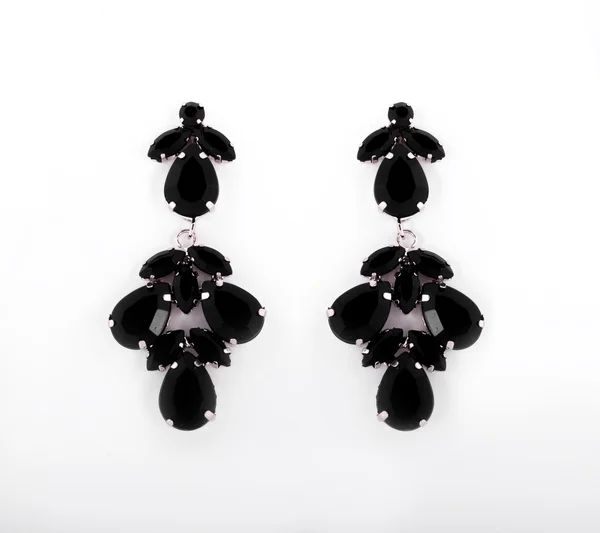 Orecchini dorati con cristalli neri — Foto Stock