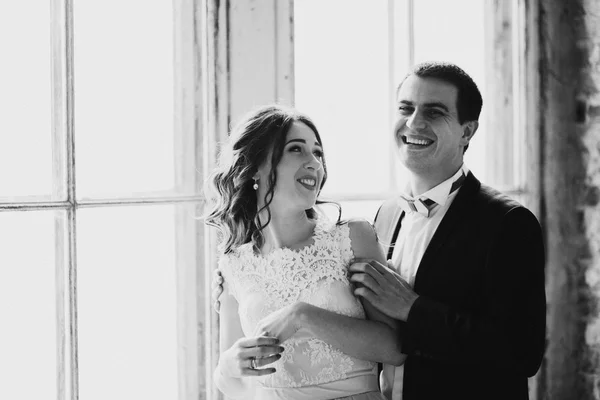 Married couple by the window — Stock Photo, Image