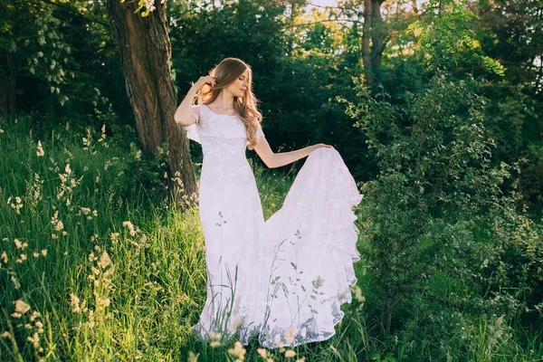 Woman in a white dress in the forest — Stock Photo, Image