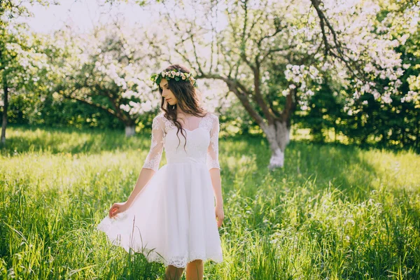 Bride in the blooming garden — Stock Photo, Image