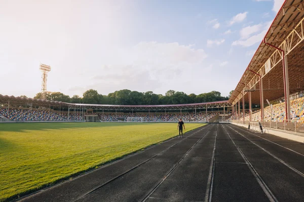 Runner on the track at a sport stadium — Stock Photo, Image