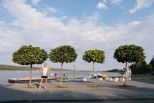 Older man is engaged in running in the fresh air — 스톡 사진