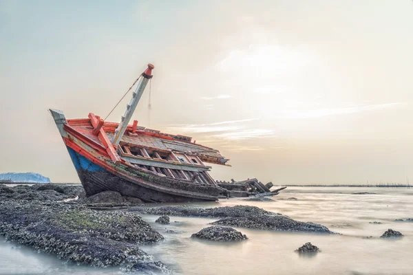 Fishing boat capsize at twilight blackground