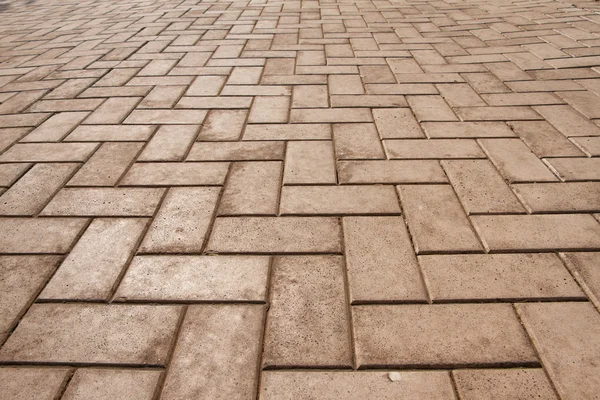 Primer plano marrón con patrón de losas de pavimentación naranja — Foto de Stock