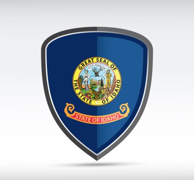 Gri arka planda Idaho Eyalet Bayrağı olan bir kalkan simgesi. Vektör illüstrasyonu.
