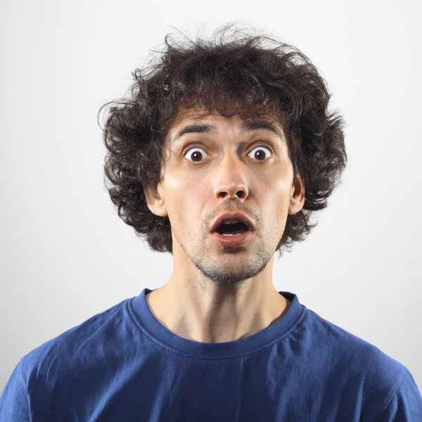 Surprised young man portrait.