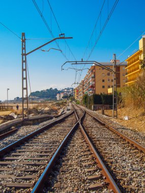 train tracks next to the sea in Maresme, Catalonia clipart