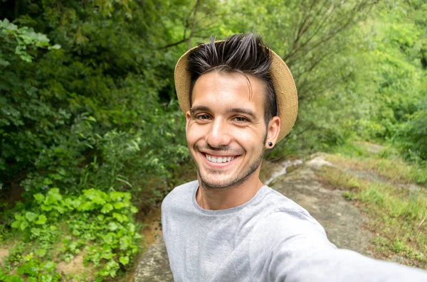  Guy is taking a selfie in the nature - Stock Image - Everypixel
