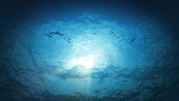 Прекрасні підводні сонячні промені, що сяють крізь глибоку блакитну чисту воду безшовно. Цикл 3d Анімація поверхні крилатої води з глибини. 4k Ultra HD 3840x2160 . — стокове відео