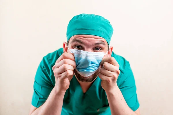 Funny doctor in a cap and a medical mask. High quality photo