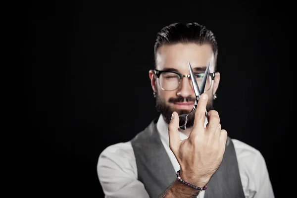 Stylish hairdressers in the studio with scissors — Stock Photo, Image