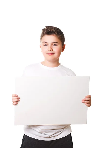 Funny little boy holding a large white plate for your text — Stock Photo, Image