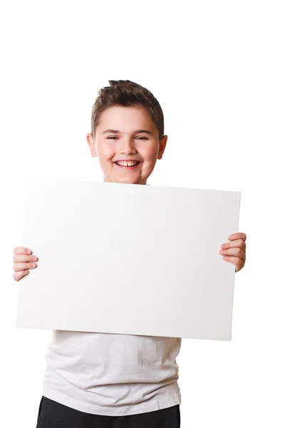 Funny little boy holding a large white plate for your text — Stock Photo, Image