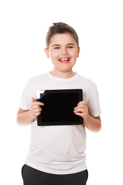 Niño con una tableta aislada en blanco —  Fotos de Stock