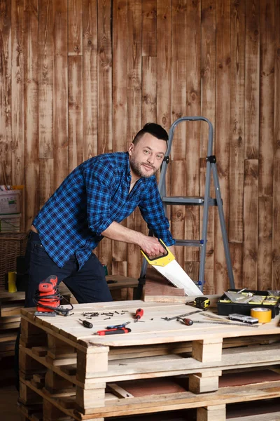 The man in the garage. the concept of repair — Stock Photo, Image