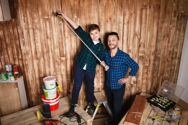 Construction of father and son in the garage, — Stock Photo, Image