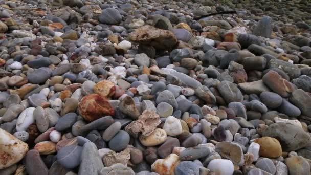 Rocks near the lighthouse in the end of island — Stock Video
