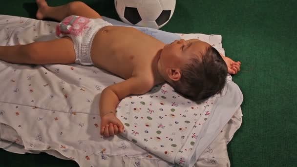 Sleeping child with soccer — Stock Video