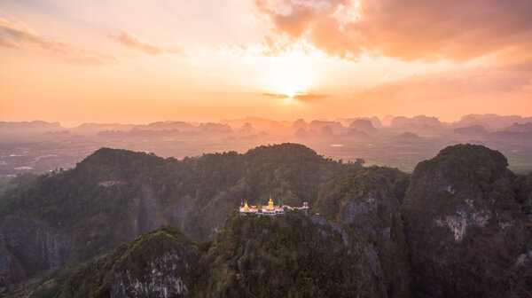 One of the most sacred Buddhist sites in Thailand it is well known for the tiger paw prints in the cave, tall Buddha statues and the strenuous flight of stairs to reach the summit Buddha and pagoda On the steep peaks.