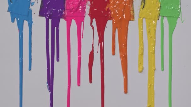 Rainbow Paints Slowly Dripping Color Scoop Handles — Stock Video