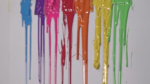 Rainbow Paints Slowly Dripping Color Scoop Handles — Stock Video