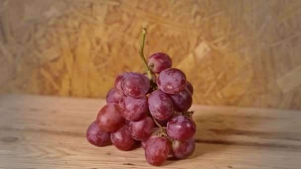 Bunch Grapes Placed Wooden Background — Stock Video