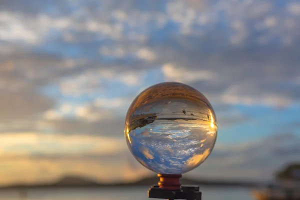 sunset sunrise view inside crystal ball.Unconventional and beautiful natural views of the sea in a magic crystal ball. Nature video High quality footage. Unique and creative travel and nature idea