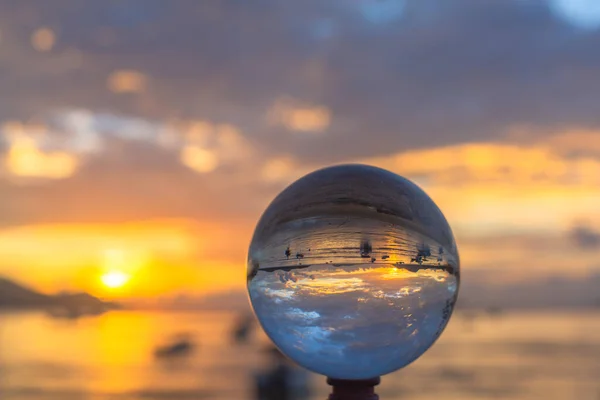 sunset sunrise view inside crystal ball.Unconventional and beautiful natural views of the sea in a magic crystal ball. Nature video High quality footage. Unique and creative travel and nature idea