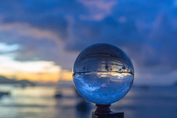 sunset sunrise view inside crystal ball.Unconventional and beautiful natural views of the sea in a magic crystal ball. Nature video High quality footage. Unique and creative travel and nature idea