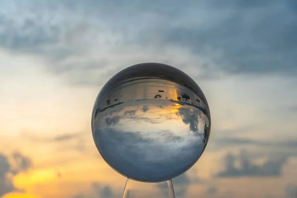 view of the sea and sky inside crystal ball. The natural view of the sea and sky are unconventional and beautiful.