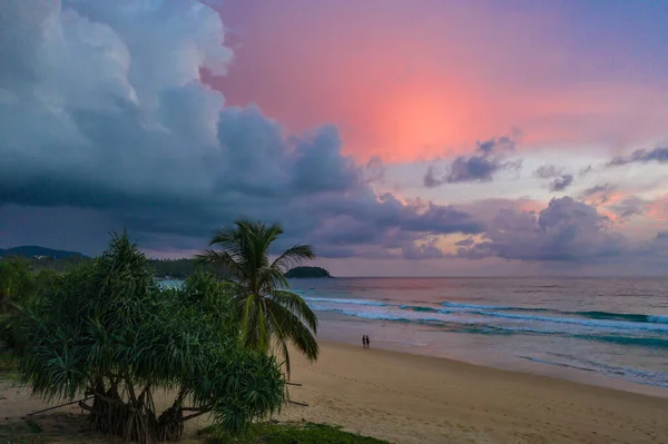 aeriall view scenery sunset above the ocean clouds cover the ocean during colorful cloud in sunset on Karon beach Phuket Thailand. video 4K. Scene of Colorful red light in the sky background.