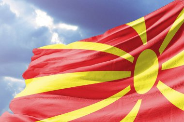flag of macedonia waving against blue sky. 3 d rendering.